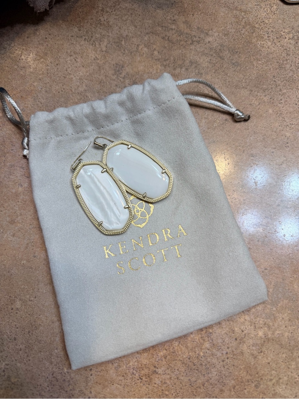 Earrings on Kendra Scott pouch